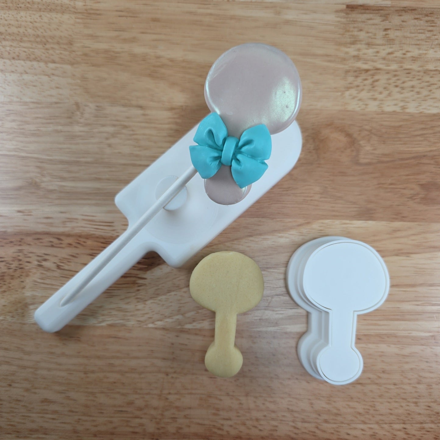 Rattle cake pop with cutter and cut dough