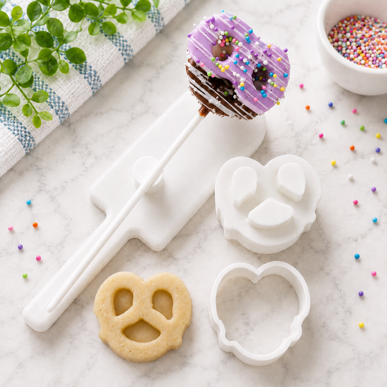 Pretzel cake pop with cut dough and the cutter and embossed plunger