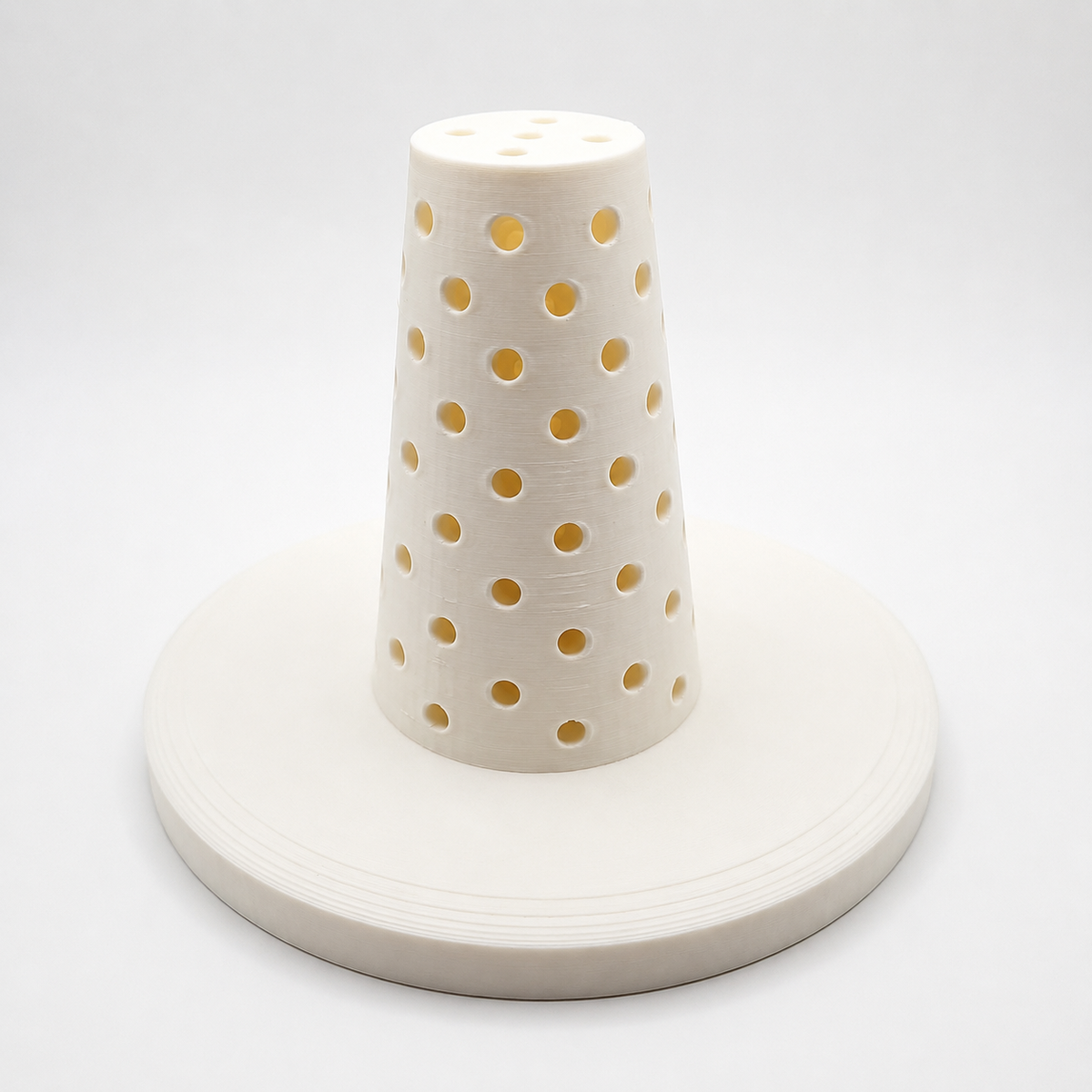 A white cone-shaped flower tower to make flower and cake pop centerpieces
