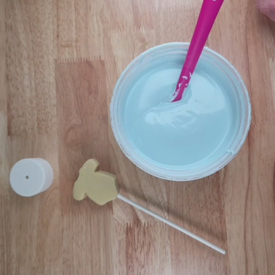 Dipping a onesie cake pop